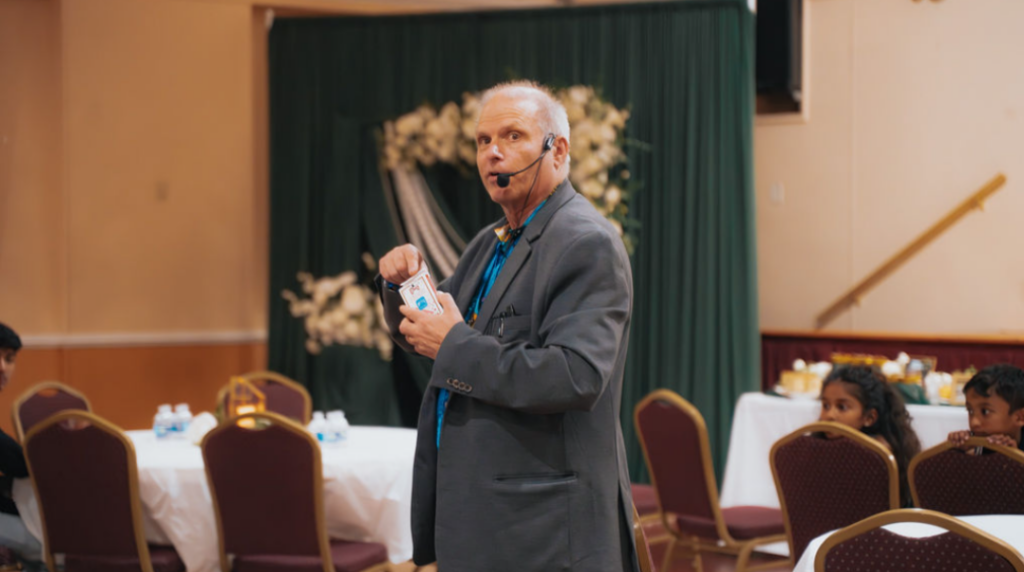 Rick Deezie presenting interactive magic and mentalism during a Philadelphia-area corporate event.